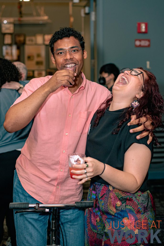 Smiling friends enjoying drinks at a party.